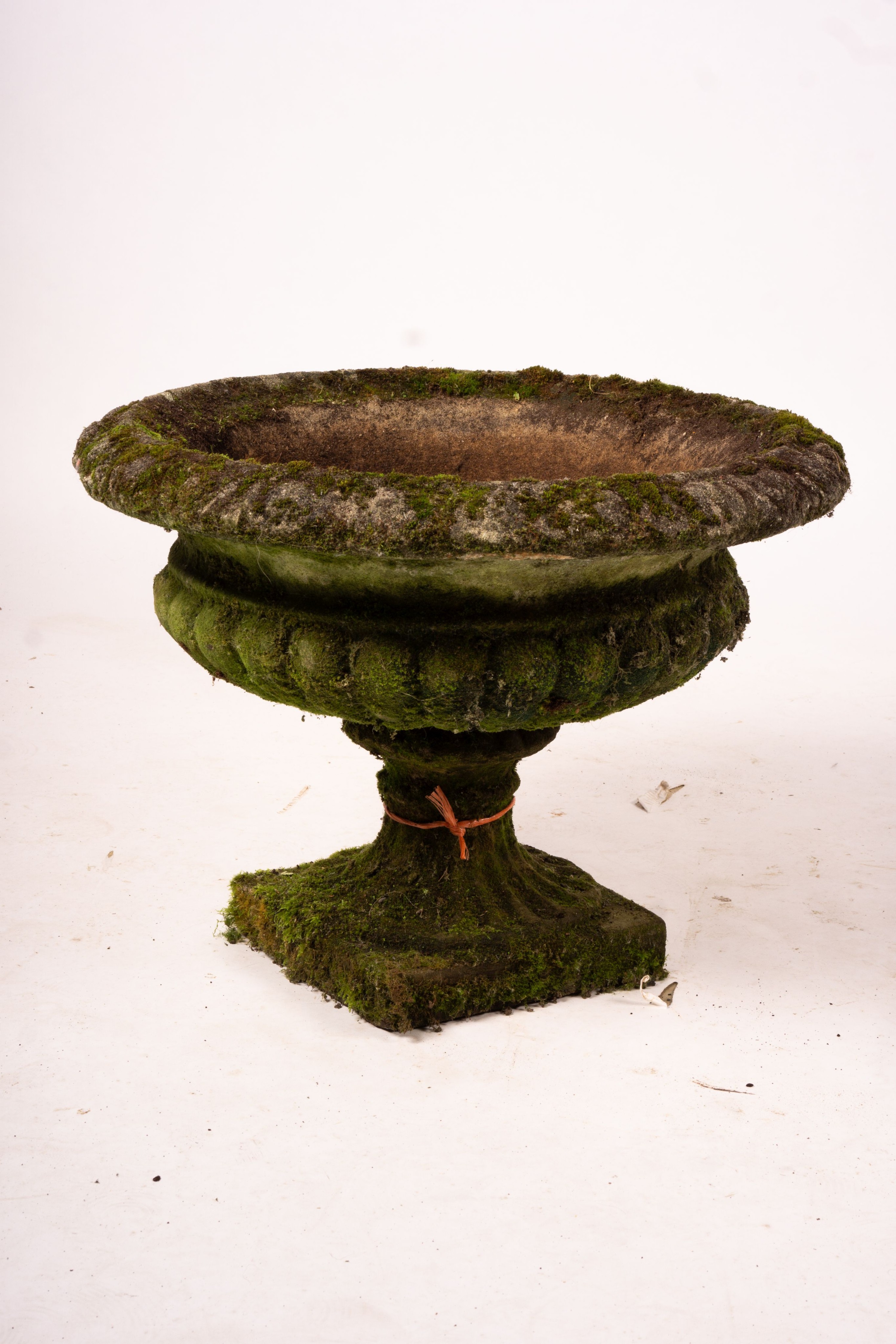 A pair of weathered reconstituted stone campana garden urns, Diam.56cm H.42cm